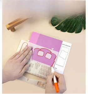 Detailed view of DIY stencil kit with home furniture patterns for creative journaling