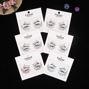 Six packs of colorful acrylic face gems and crystals for eye makeup decoration on black surface
