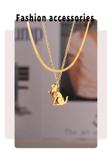 Detail of gold-plated double-layer necklace featuring a minimalist cat pendant and O-chain