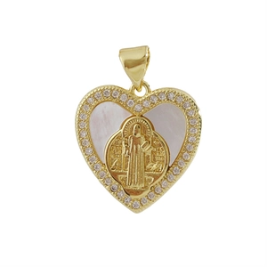 Macro shot of gold-plated heart cross pendant with rhinestones and white mother of pearl