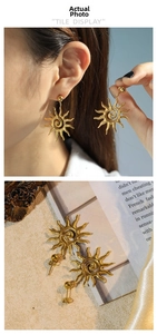 Dettaglio di orecchini a sole in oro 18K con finitura martellata in stile boho