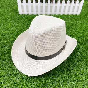 Close-up of woven straw fedora hat texture with black leather band and metal buckle detail