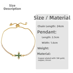 Detail view of 18K gold plated cross bracelet featuring green zircon and 24cm adjustable chain
