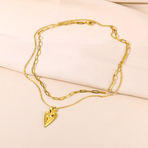 Detail of 18K gold stainless steel double layered necklace with 3D heart pendant