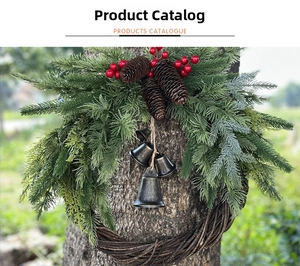 Close-up of Christmas wreath with pine needles, red berries, and vintage metal bells