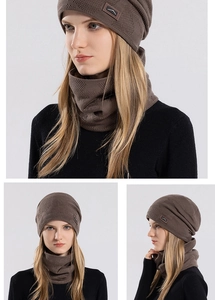 Detailed knit texture and leather mountain patch on winter beanie and scarf set