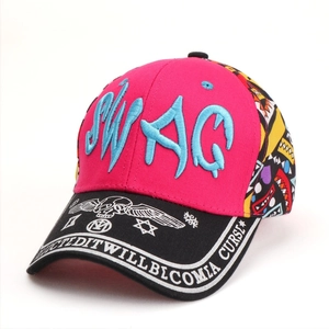 Detail of embroidered SWAG letter logo and printed eagle wings on baseball cap brim