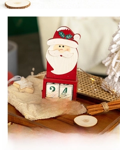 Detailed view of a wooden Santa countdown calendar with movable date blocks on a tray
