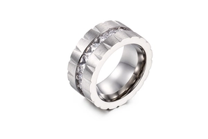 Detail of matte silver titanium ring with channel-set square zircon and gear-edge design