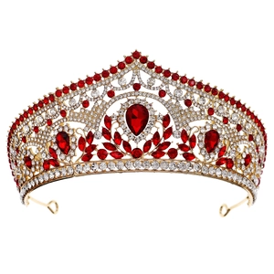 Luxurious bridal crown with gold metal base and sparkling red teardrop rhinestones
