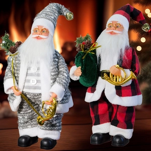 Detailed view of two standing Santa Claus dolls with festive bags and musical instruments