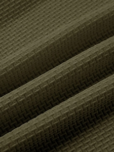Macro view of olive green waffle knit fabric texture on breathable athletic t-shirt