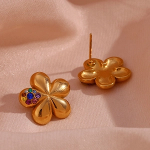 Detailed close-up of 18K gold plated flower earrings with inlaid colorful gemstones