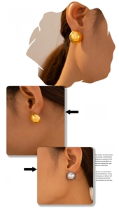 Detailed view of half-round dome stud earrings in polished gold and silver finishes