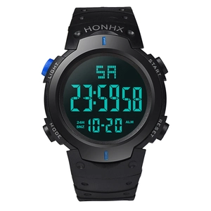 Close-up of digital sports watch with black rubber strap and blue functional buttons