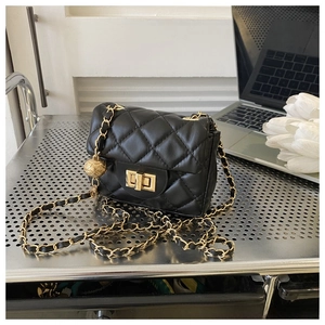 Close-up of quilted black leather mini bag featuring gold twist lock and chain strap