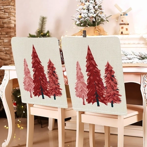 Close-up of beige linen chair covers with red and pink Christmas tree patterns