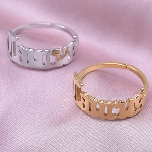 Detailed macro view of 1994 gothic year cutout rings in gold and silver steel