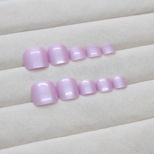Set of 10 fluorescent purple pearl toe nail tips on a soft beige velvet display stand