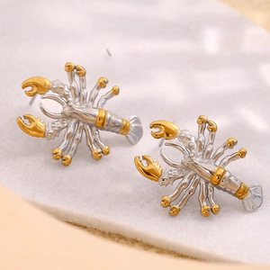 Macro detail of bionic lobster earrings featuring a two-tone gold and silver plated finish