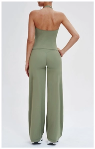 Detail of sage green sports set showing back cut-out top and V-shape high waist pants