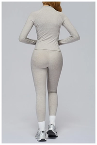 Detail view of marl grey athletic set featuring seamless leggings and zip jacket