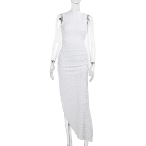Detail of white sleeveless dress with pleated texture and asymmetric split hem design