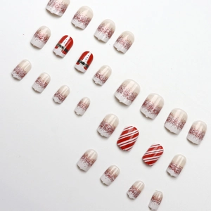 Christmas Santa press-on nails with red white stripes and glitter gradient in short oval shape