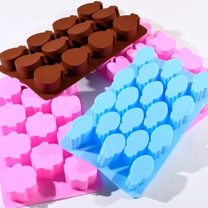 Close-up of food-grade silicone molds in brown, pink, and blue showing flexible texture