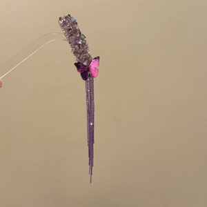 Elegant purple butterfly hair clip with crystal accents and long fringe tassel charms