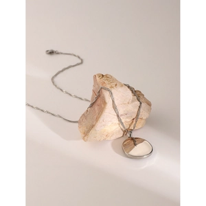 Minimalist 18k gold stainless steel necklace with polished round pendant on natural stone