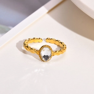 Twisted titanium steel open ring with sparkling white oval zircon stone in gold finish
