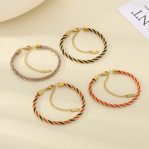 Detail of twisted rope bracelets with gold stainless steel wires and adjustable lobster clasp