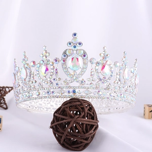 Detail of silver bridal crown featuring heart-shaped rhinestones and aurora crystals