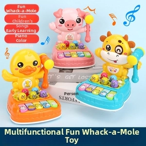 Close-up of animal-themed toy with hammer, piano keys and light-up music features