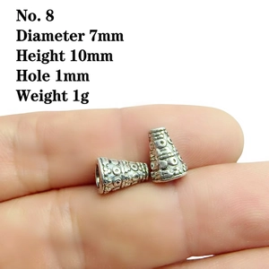 Macro detail of size 8 vintage alloy flower cap bead with 7mm diameter for jewelry making