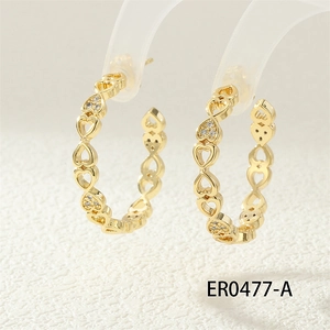 Detail view of gold chain earrings featuring hollow heart design with micro-pave cubic zirconia
