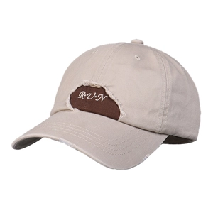 Distressed khaki baseball cap with R·U·N embroidery and ripped detailing for a vintage look