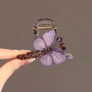 Elegant purple butterfly hair claw clip with embroidered wings and beaded texture details