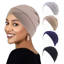 Detail showing various colors and elastic braided cross design of the turban headwrap