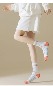 Detail of five-toe sports socks featuring anti-slip grip and breathable knit fabric