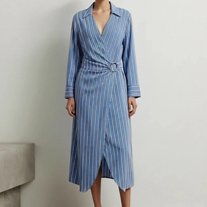 Detail of blue striped shirt dress showing silver metal buckle and wrap waist design