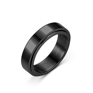 Close-up of a black rotating titanium steel ring featuring a sleek matte brushed finish