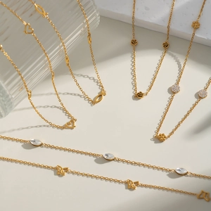 Selection of minimalist 18K gold plated titanium steel necklaces with diverse pendants
