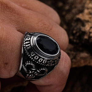 Vintage stainless steel ring with black gemstone and embossed Eye of Horus motifs