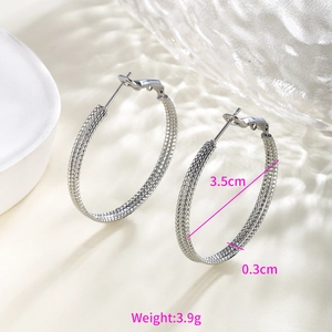 Macro shot of large silver hoop earrings with chain texture, 3.5cm diameter details