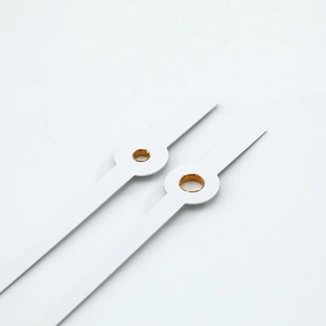 Minimalist white aluminum clock hands set with golden brass center bushings