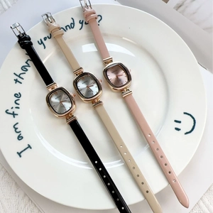Three elegant vintage square quartz watches for women with leather straps in neutral tones