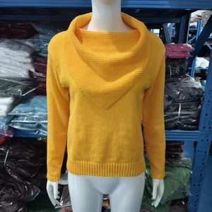 Detailed close-up of the elegant draped oversized collar on this yellow knit sweater