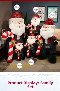 Detail of assorted Santa plush dolls in denim overalls with Merry Christmas embroidery